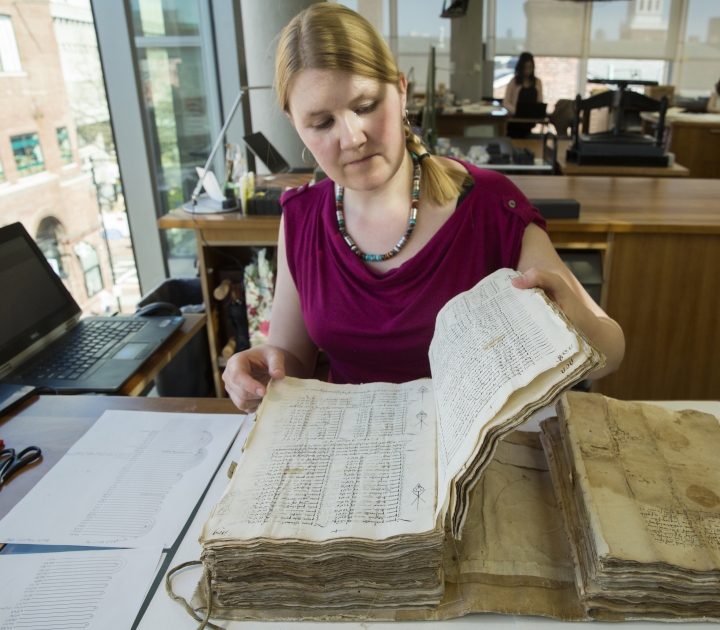 Katherine Beaty with a book at Harvard University