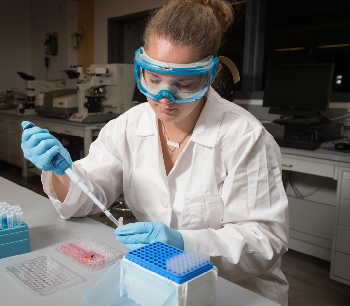 Female student working in chemistry lab