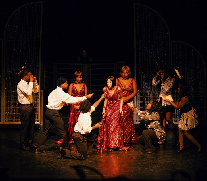 Cast members of Dreamgirls in a scene