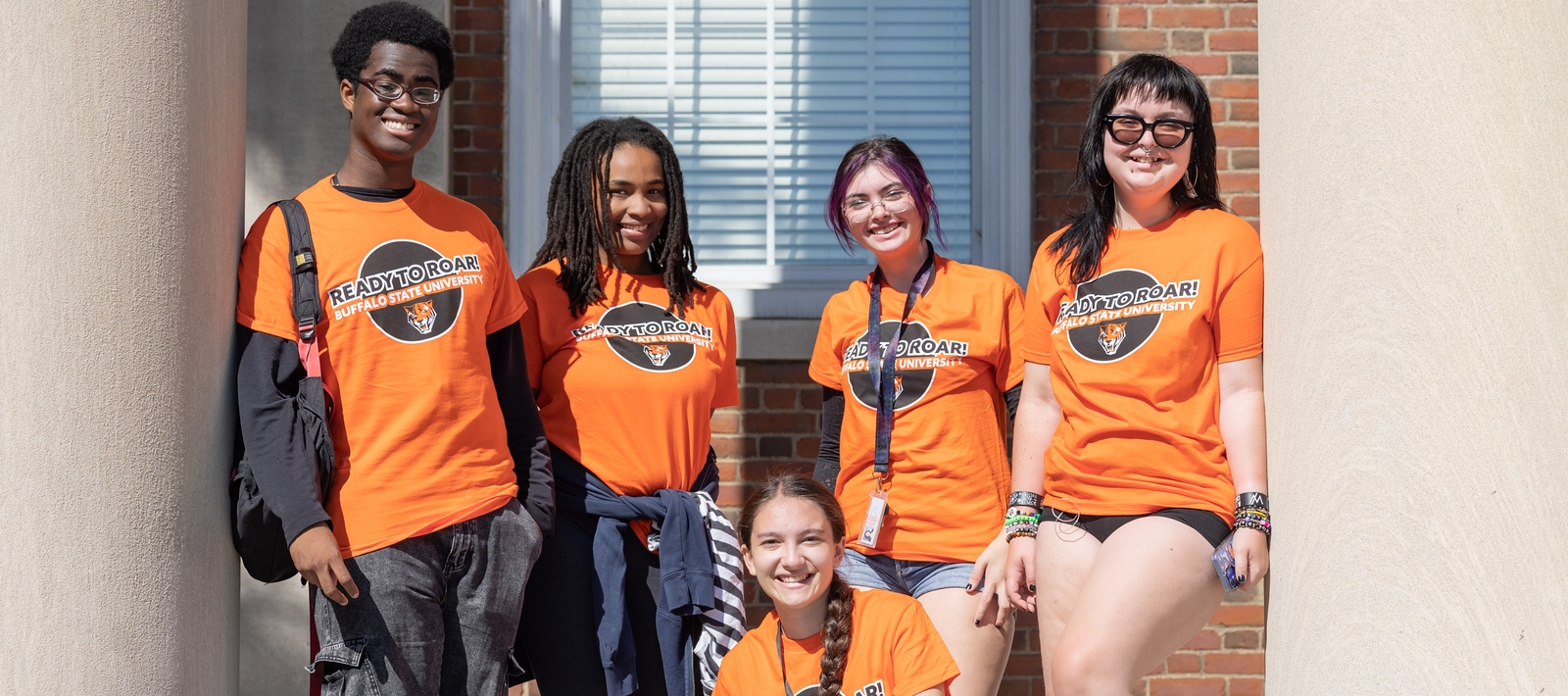 Students standing by Rockwall Hall columns